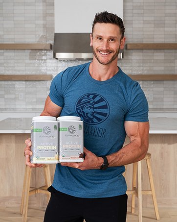 Thomas Delauer holding Sunwarrior Active Protein